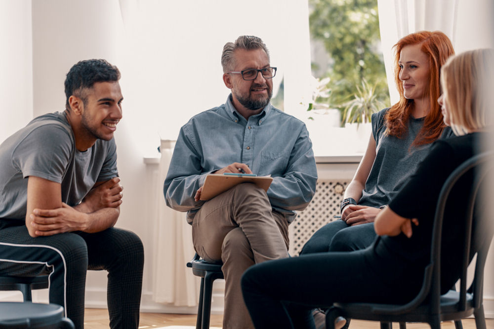 people attending a support group for amphetamine addiction recovery
