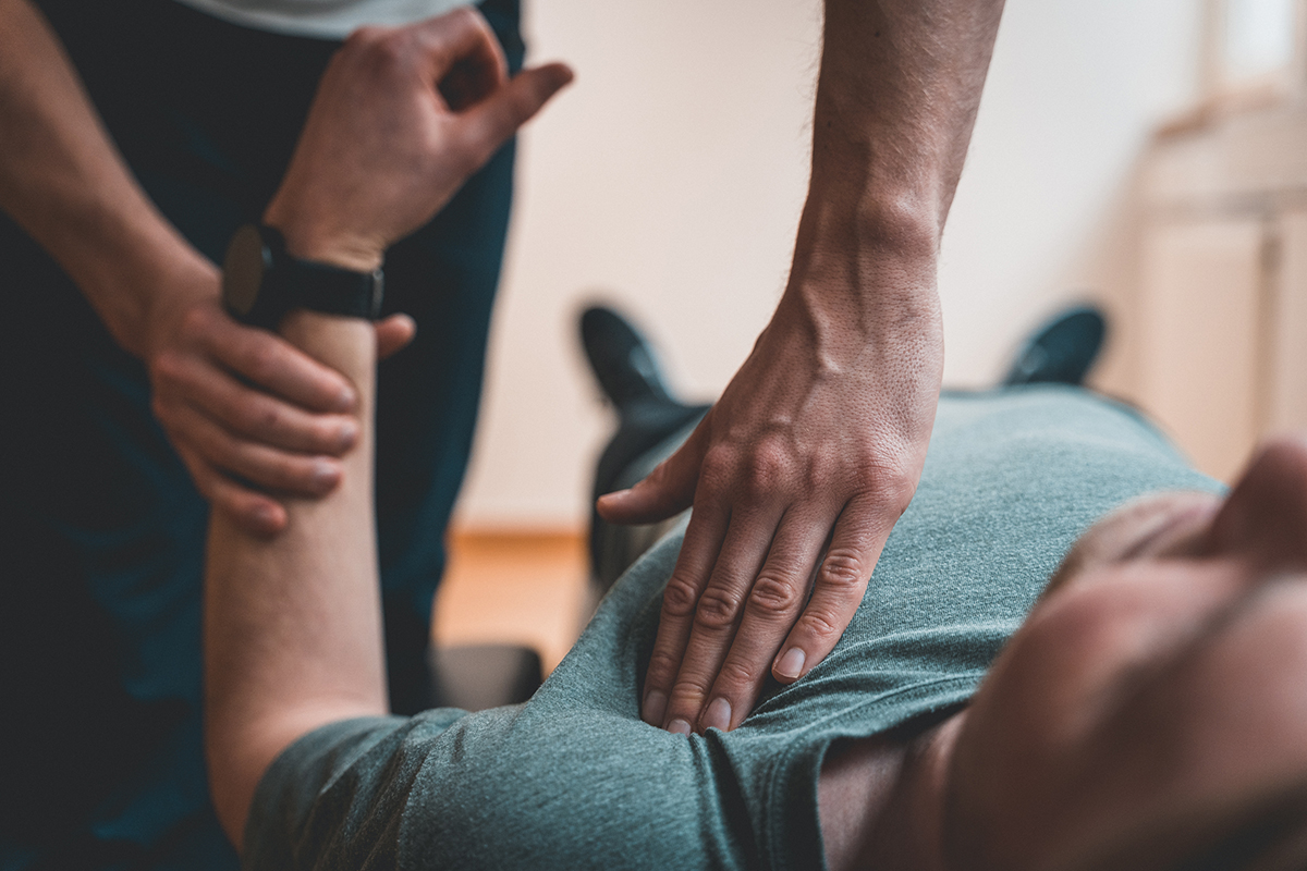 Man receiving physical therapy to support his recovery