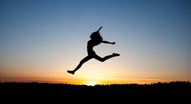 silhouette of woman jumping 