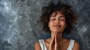 Women meditating indoors with a smile