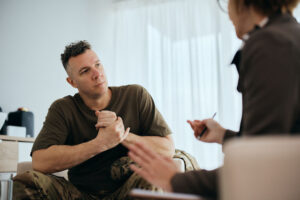 Man with anxiety learning about the cycle of anxiety from a therapist