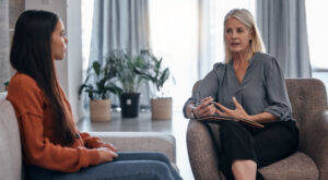 Therapist explains character defects to a listening patient.