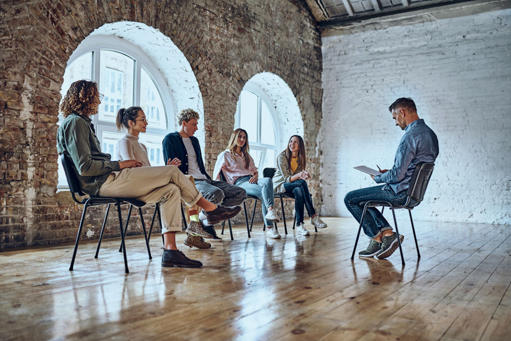 Bipolar disorder support group receiving education in loft.