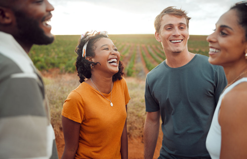 Happy people spending time together in a field.
