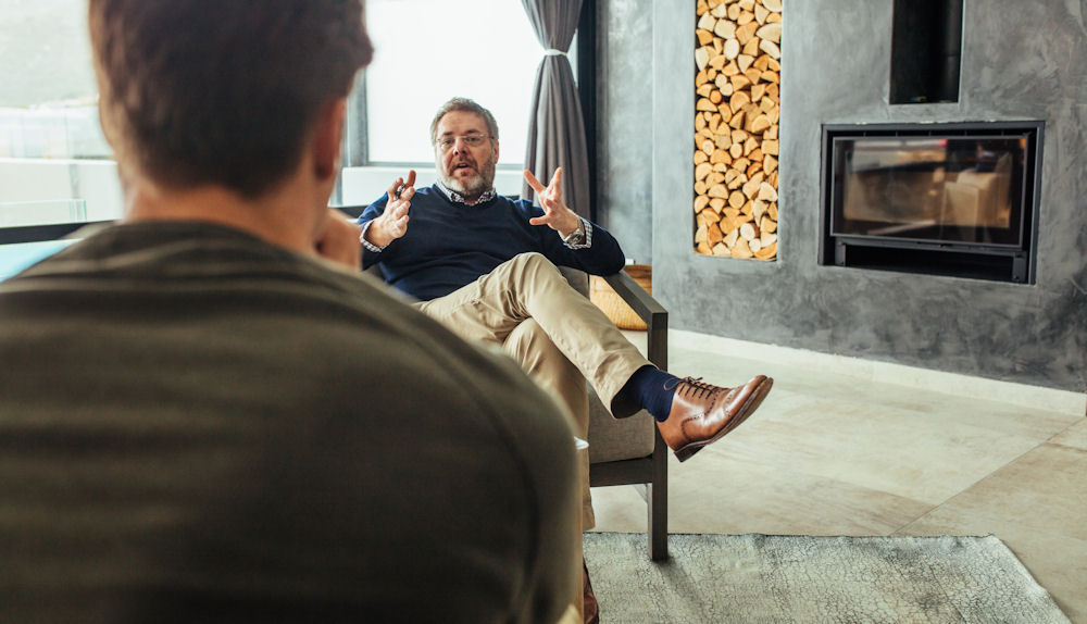 Man explaining anxiety to a specialist therapist.