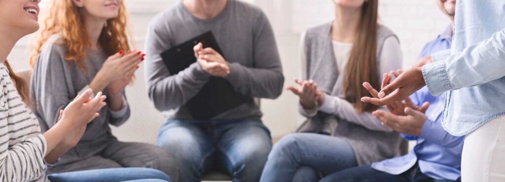 Group of people discussing if kratom is addictive.